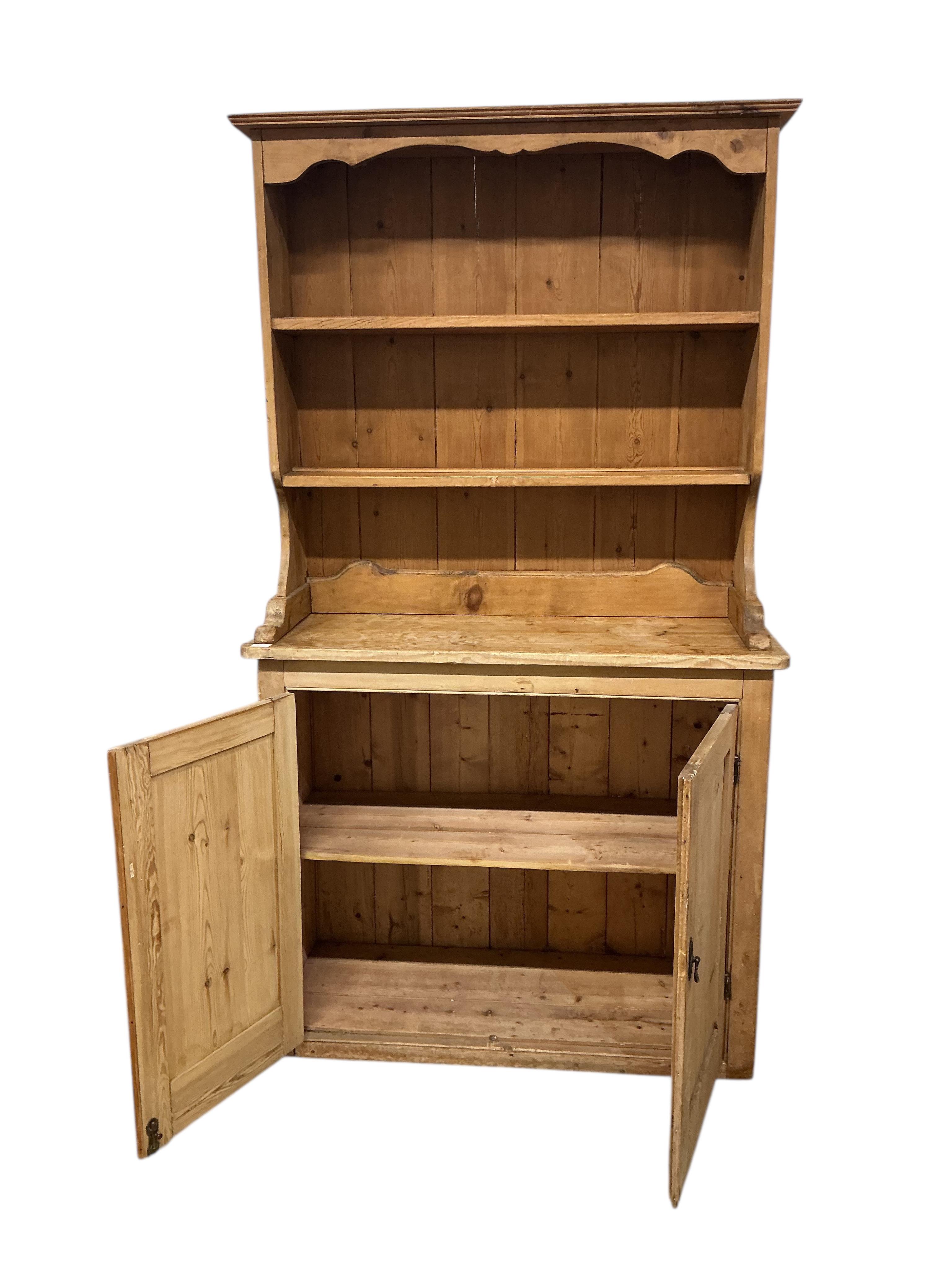 A Victorian pine dresser with associated boarded rack, width 116cm, depth 45cm, height 207cm